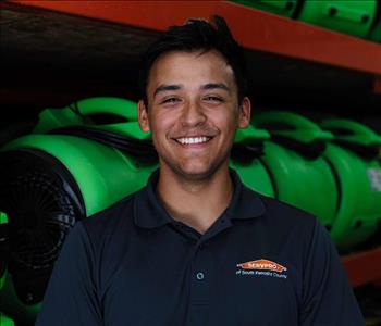 Male with servpro polo in front of equipment